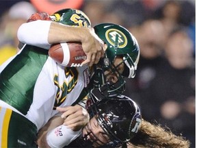 Redblacks defensive tackle Connor Williams takes down Edmonton Eskimos quarterback Mike Reilly during Friday’s Canadian Football League game at Ottawa’s TD Place.