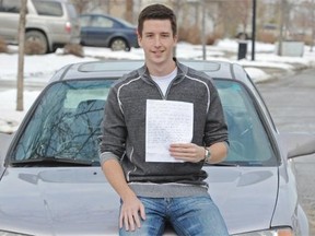 Second-year law student Derek Murray holds a note in front of his car that was left on his windshield yesterday after he parked his car in a residential neighbourhood and left his lights on before he took the LRT to school. When he got back, a man who lives in the neighbourhood had left the note and a battery charger for him. The incident has stirred up a lot of social media buzz in Edmonton on Thursday Nov 20, 2014.