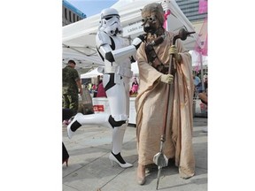 May the shoe be with you ... Storm Trooper Peter Nuthill and Tuskan Raider Mick Reid participant in the YWCA Edmonton 5th Annual YWCA Walk A Mile in Her Shoes Fundraiser to help women and children walk away from family violence, at Churchill Square in Edmonton, Sept. 23, 2014.