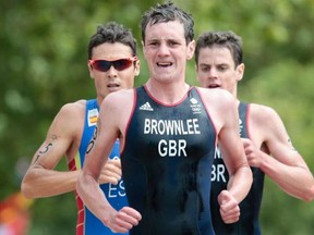 Alistair Brownlee of Great Britain, Javier Gomez of Spain and Jonathan Brownlee of Great Britain compete in the Men's Triathlon during the Men's Triathlon on Day 11 of the London 2012 Olympic Games at Hyde Park on August 7, 2012 in London, England.