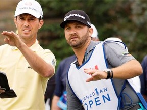 Mike Weir discusses a shot with his caddy, Danny Sahl, formerly one of Alberta’s top juniors who hasn’t given up his dream of playing on the PGA Tour.