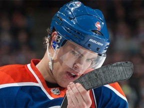 Taylor Hall of the Edmonton Oilers checks his stick during the game against the Arizona Coyotes on Nov. 16, 2014 at Rexall Place in Edmonton