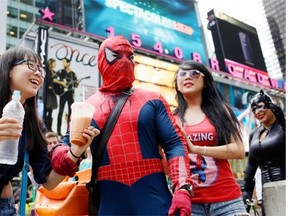 A standoff has erupted between Times Square cartoon characters and the New York Police Department over tourists taking tips from tourists for photographs. This is just one of a number of off the wall business briefs.