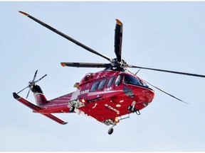 A STARS air ambulance banks as it heads for the U of A Hospital in Edmonton on Friday, March 14, 2014. (Edmonton Journal/Journal)