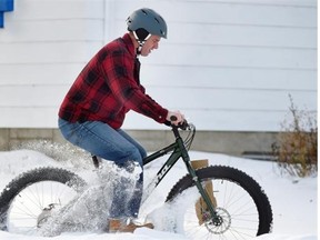 Mud, Sweat and Gears part time employee (and full time time Edmonton Station 10 firefighter) Mike Rajotte tests out a new Kona “Wo” fatbike in the snow in Sherwood Park on Monday Dec. 8, 2014.