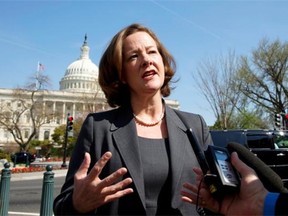Then premier Alison Redford speaks to reporters as she arrives for meetings on Capitol Hill in Washington on April 10, 2013.