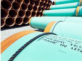 This May 24, 2012, file photo shows some of about 500 miles worth of coated steel pipe manufactured by Welspun Pipes, Inc., originally for the Keystone XL pipeline, stored in Little Rock, Ark.