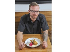 Three Boars Eatery chef Brayden Kozak has created a dish of southern fried whole quail with smoked cheddar grits, pickled cabbage, white radish and gravy.