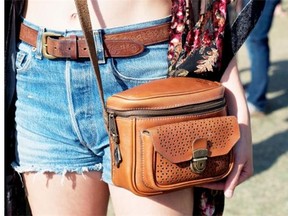 Tooled leather accessories, such as this belt and bag, are trending for festival style.