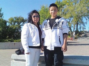 Tyrell Darc Skylar Raine, 15, stands with his mother, Rosanne Tracy Raine, shortly before his death by suicide in 2012. Tyrell Raine was a ward of the province when he hanged himself outside his group home.