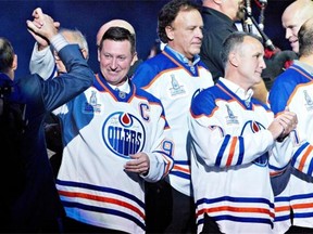Wayne Gretzky, Dave Lumley and Paul Coffey take part in the Edmonton Oilers 1984 team, reunite to mark the 30th anniversary of the team’s first Stanley Cup at Rexall Place in Edmonton, October 10, 2014.