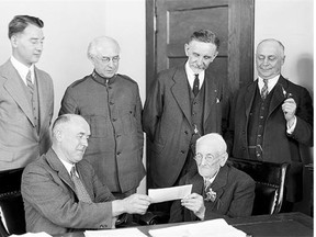 William Lee, 101, is the first Albertan  presented with a  pension cheque in 1929.