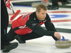 Winnipeg’s Jeff Stoughton delivers a rock during a game in the Direct Horizontal Drilling Fall Classic at the Crestwood Curling Club on Friday, Oct. 10, 2014.