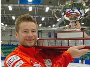 Winnipeg’s Mike McEwen poses with the Canada Cup trophy after winning the men’s final over Brad Jacobs of Sault Ste. Marie, Ont., on Sunday night at Encana Arena in Camrose