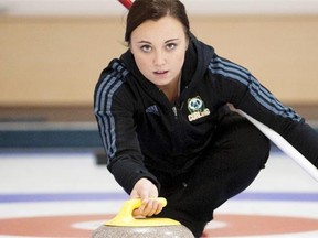 World junior women’s curling champ Kelsey Rocque demonstrates how to throw a curling rock at the Saville Community Sports Centre on Sept. 23, 2014.