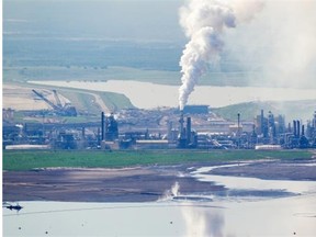 An aerial view of Syncrude’s oilsands upgrading facility and Mildred Lake settling basin tailings pond north of Fort McMurray.