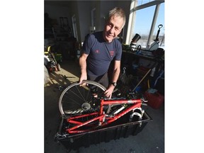 Dr. Andries Botha packs up his bicycles on his acreage southeast of Edmonton on Saturday Dec. 27, 2014 before heading to Africa to cycle from Cape Town to Cairo.