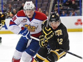Brett Pollock of the Edmonton Oil Kings chases Reid Gow of the Brandon Wheat Kings during Tuesday’s Western Hockey League game at Rexall Place.