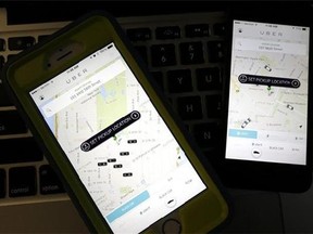 Smart phones displaying Uber car availability. The ride-hailing app expects this New Year’s Eve to be its busiest night ever.