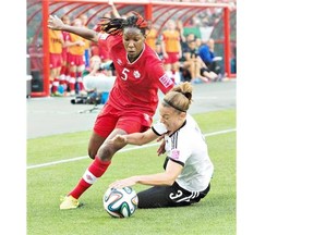 Canada’s Kadeisha Buchanan tries to kick the ball away from Germany’s Felicitas Rauch during a FIFA U-20 women’s World Cup quarter-final game at Commonwealth Stadium on Aug. 16, 2014.