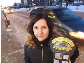 Cheryl Kasianiuk outside her shop Bosom Babies on Thursday. The city is thinking about pulling out these parking meters and building a temporary parking lot across 104th Avenue to replace them.