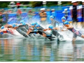 Competitors hit the water to start the Under-23 mixed relay and junior event at the World Triathlon Series Grand Final at Hawrelak Park on Sept. 1, 2014.