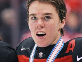 Connor McDavid of Team Canada wears the gold medal after defeating Team Russia in the Gold medal game in the 2015 IIHF World Junior Hockey Championship at the Air Canada Centre on January 5, 2015 in Toronto.