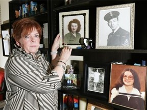 Donna Mersereau at her home in Beaumont with photos of her mother, father and sister, who have all passed away. Family urns containing the ashes of her parents and other family mementos were lost in a recent fire at Hainstock’s Funeral Home in Edmonton.