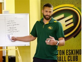 Edmonton Eskimos quarterback Mike Reilly speaks to members of the Edmonton Huskies Football Club at the Huskies’ clubhouse in September, after the Eskimos and the Calgary Stampeders announced that they are partnering with the Alberta Council of Women’s Shelters to educate young men about domestic violence and abuse against women.