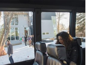 EDMONTON, AB. JANUARY 24, 2014 - Buses full of people toured around to urban neighbourhoods to experience the revitalization through infill housing as part of the Infill Tour. The first stop on this bus was in Westmount on 128 Street. Shaughn Butts/Edmonton Journal