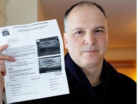 Edmonton Journal columnist David Staples holds up a photo radar ticket he got in February 2014 for travelling 10km/hour over the limit.