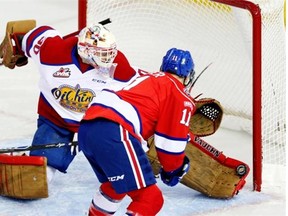 Edmonton Oil Kings goalie Tristan Jarry makes a save against Regina Pats Austin Wagner during Western Hockey League game action in Edmonton on January 16, 2015.