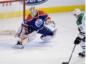 Edmonton Oilers goalie Ben Scrivens is scored on in a shootout by Dallas Stars centre Shawn Horcoff, a former Oilers captain, to win it 6-5 for Dallas on December 21, 2014 in Edmonton.