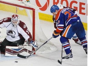 Edmonton Oilers Matt Hendricks can’t get the puck past Colorado Avalanche goaltender Jean-Sebastien Giguere during second period NHL action on April 8, 2014 in Edmonton.