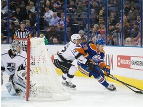 Edmonton Oilers rookie centre Leon Draisaitl beats Marian Gaborik of the Los Angeles Kings to the puck during Tuesday’s National Hockey League game at Rexall Place.