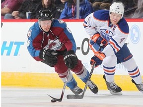 Erik Johnson #6 of the Colorado Avalanche skates against Taylor Hall #4 of the Edmonton Oilers at the Pepsi Center on Jan. 2, 2015, in Denver.