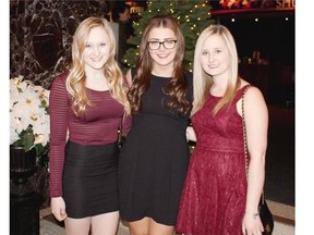 From left, Amy Ostapovich, Katie Zahn and Kristy Ostapovich at The Singing Christmas Tree on Dec. 18