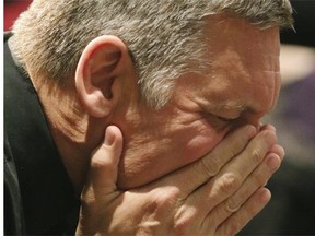 Greg Musselman prays at a joint prayer service held at the NEXT Christian Community Centre in St. Albert on Jan. 20, 2015.