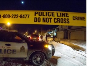Homicide detectives investigate the death of Cyndi Duong on Dec. 29, 2014. Duong, 37, was one of eight people killed in Edmonton's worst mass murder.