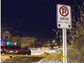 Homicide detectives investigate the suspicious death of a woman at a south-side residence Monday night. Edmonton Police Service responded to a weapons complaint at a residence near Haswell Court and 16th Avenue near Terwillegar Drive just before 7 p.m. Monday evening in Edmonton on December 29, 2014.
