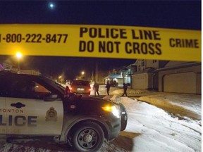 Homicide detectives investigate the suspicious death of a woman at a south-side residence Monday night. Edmonton Police Service responded to a weapons complaint at a residence near Haswell Court and 16th Avenue near Terwillegar Drive just before 7 p.m. Monday evening in Edmonton on December 29, 2014.