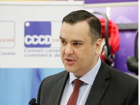 Industry Minister James Moore announces legislation aimed at ensuring prices in Canada are not unfairly higher than those in the U.S., in Toronto, on Dec. 9, 2014. The legislation will do little to help explain the difference in pricing from country to country, argues Mark Milke.