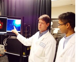John Lewis, left, is leading the development of a more accurate test for prostate cancer. Srijan Raha is a researcher, funded by a donation by the Building Trades of Alberta.