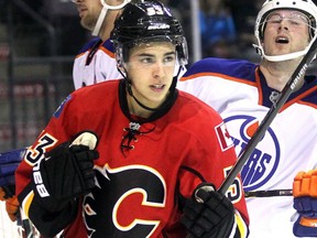 Calgary Flames prospect Johnny Gaudreau pumps his fist after scoring on the Edmonon Oilers in the first period in the Youngstars Tournament in Penticton, B.C., on Sept. 13, 2014.