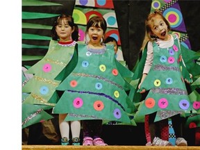 Kindergarten class children (left to right) Natasha Roth, Tiffini On and Madelyn Lam perform a Christmas tree song during Meadowlark School’s annual Christmas concert on Dec. 18, 2014.