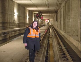 Kristy Trinier, curator with the Art Gallery of Alberta, poses for a photo in an unused LRT station that was built in the 1970s but never used, and is the inspiration for Future Station, the 2015 Alberta Biennial of Contemporary Art.