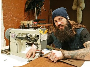 Kyle Closen, owner of Clos Custom Fine Leather Goods, at his shop in basement of the Mercer Building