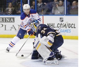St. Louis Blues goalie Jake Allen makes a stick save on a shot from the Edmonton Oilers’ Jordan Eberle during Tuesday’s National Hockey League game at the Scottrade Center in St. Louis.