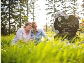 Marilyn Koren and her daughter Jamie Sullivan visit the gravesite of Jamie’s daughter Delonna near Warburg. Delonna was just four months when she died in April 2011. Born in November 2010, her obituary noted she never lived to see the beauty of a summer day.