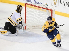 Nashville Predators center Derek Roy (21) scores a goal past Boston Bruins goalie Tuukka Rask (40), of Finland,  during a shootout at an NHL hockey game Tuesday, Dec. 16, 2014, in Nashville, Tenn. The Predators won the shootout to win the game 3-2. Predators' Derek Roy scored the only goal in the shootout. (AP Photo/Mark Zaleski)